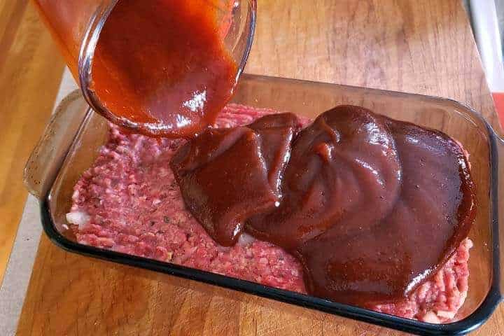 pouring sauce on meat