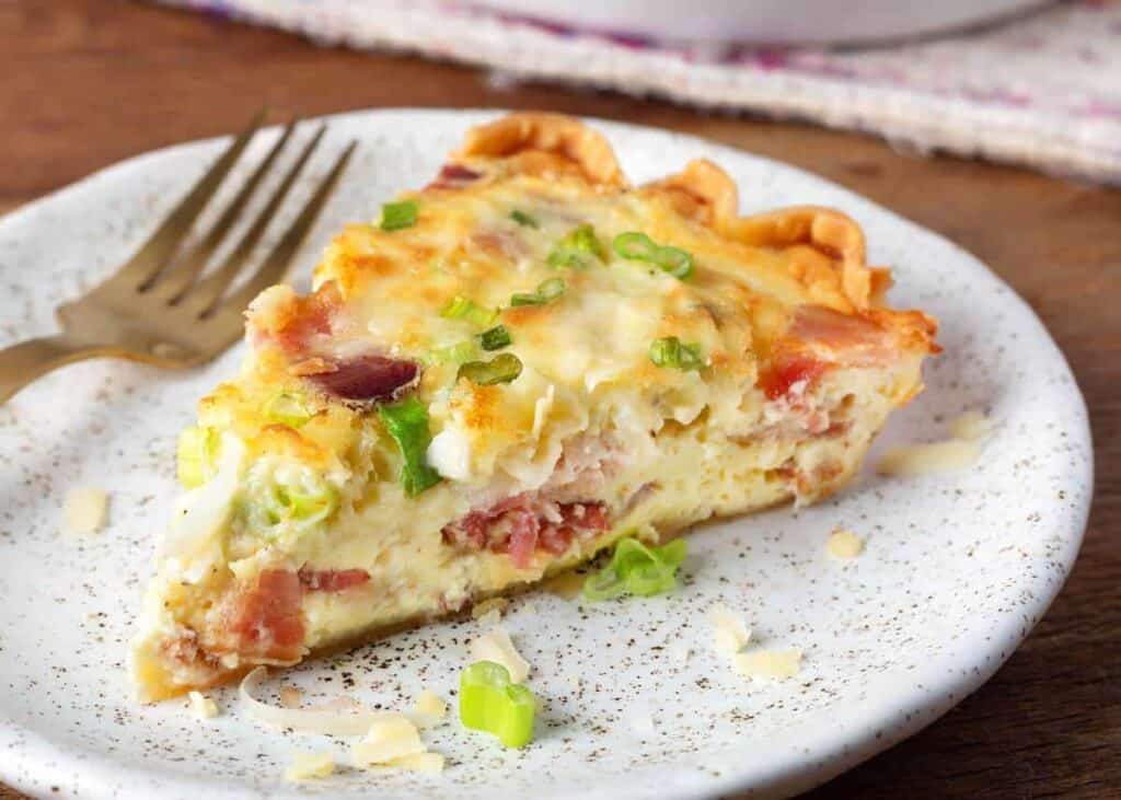 Slice of Quiche on a white plate