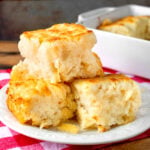 butter swim biscuits stacked on a white plate