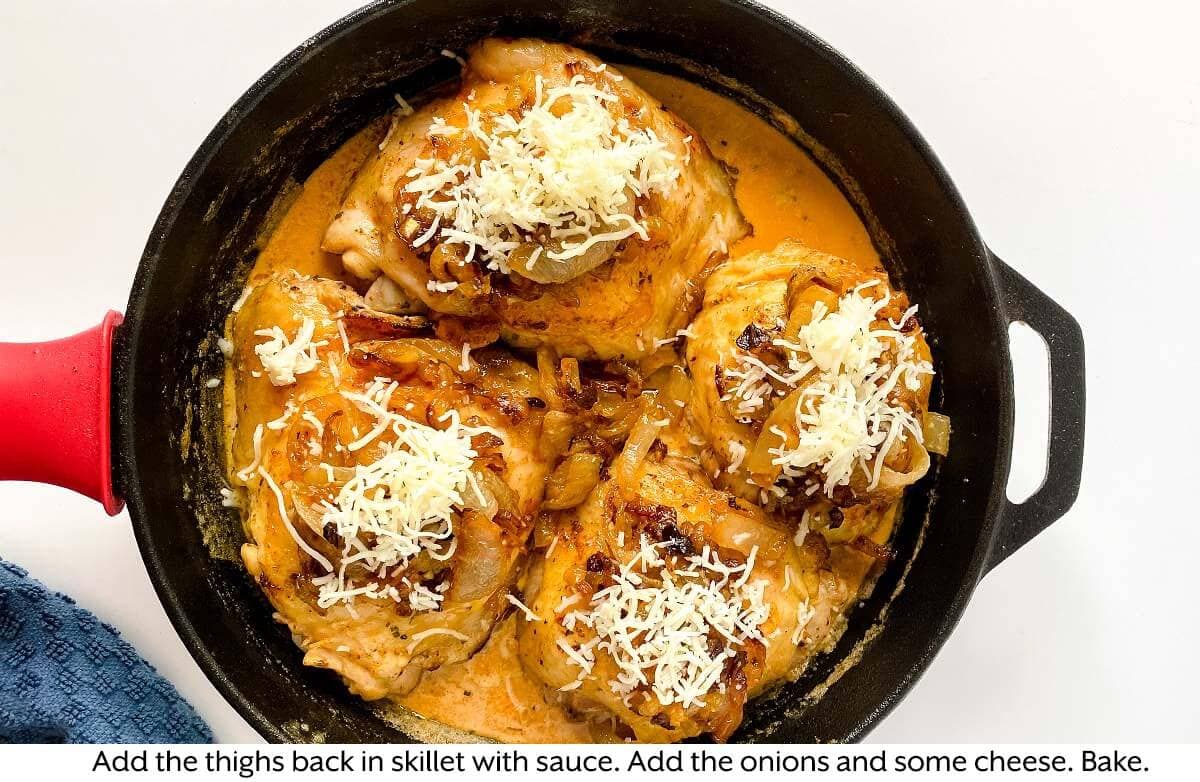chicken thighs in skillet with the sause and onions & cheese