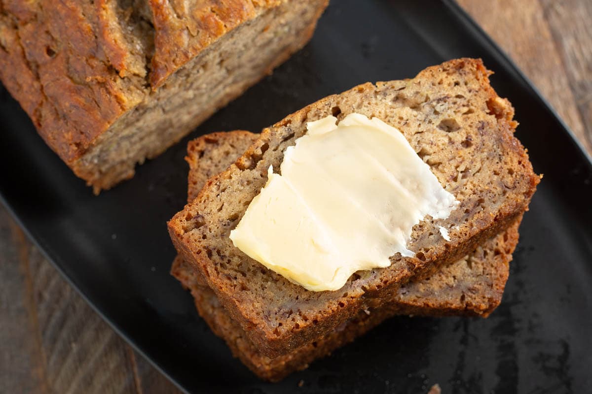 slice of banana bread with butter on it