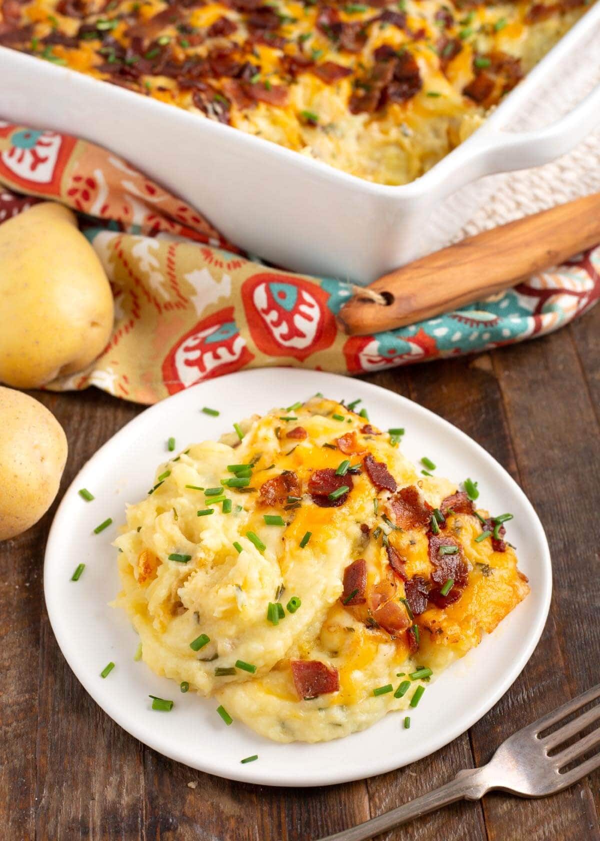 potato casserole in a baking dish and on a white plate