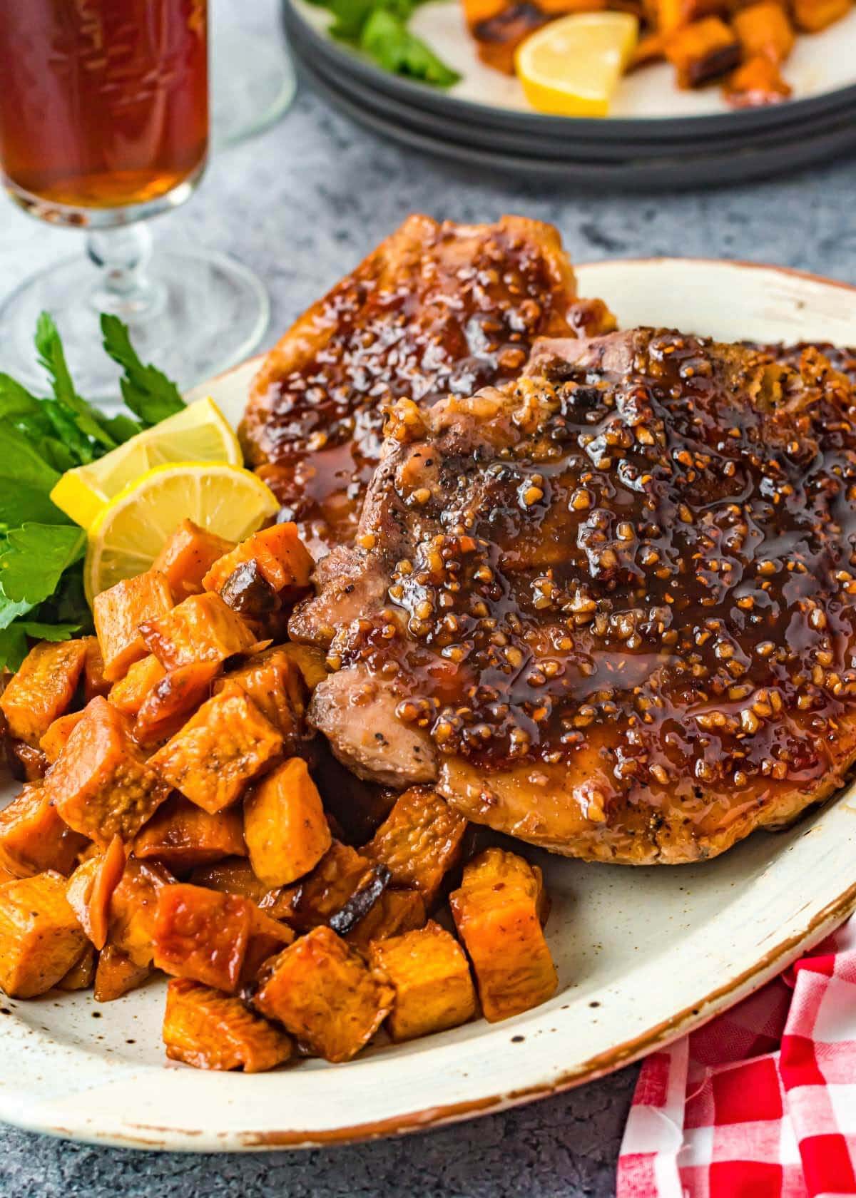 Maple Glazed Pork Chops and Sweet Potatoes on a white platter