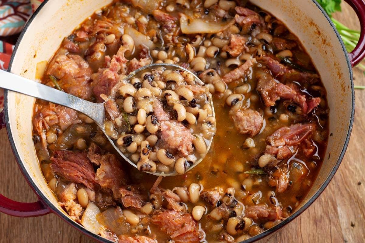 Black-Eyed Peas in a red pot with ladle