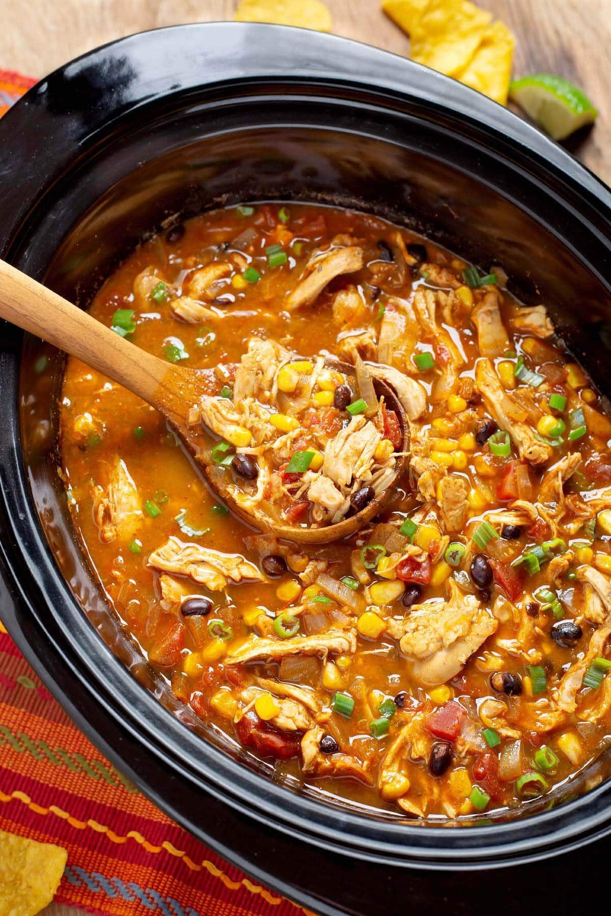 Slow Cooker Chicken Tortilla Soup in crock with spoon
