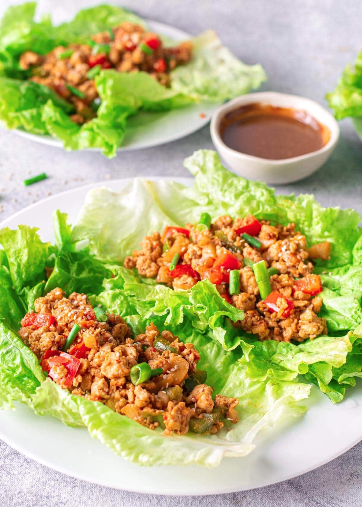 Asian Chicken Lettuce Wraps on a white plate