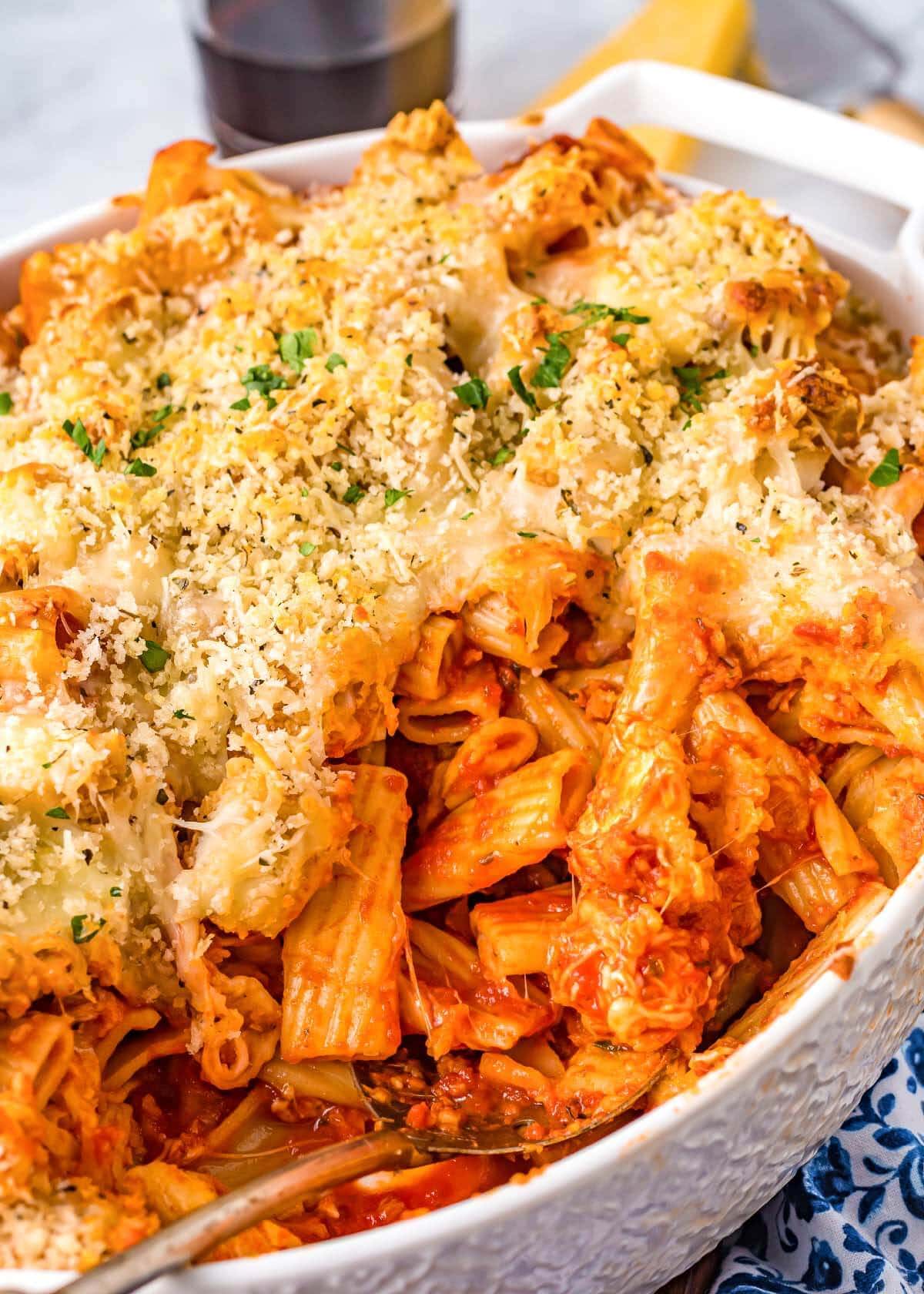 Chicken Parmesan Casserole in a dish with a spoon