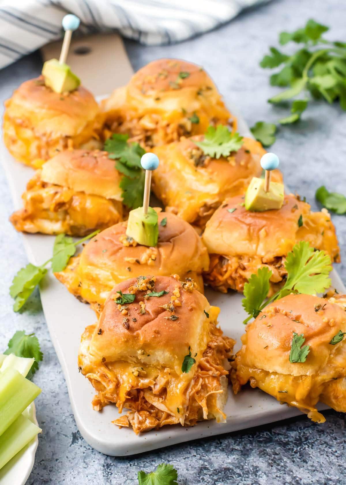 Chicken Enchilada Sliders on a rectangle tray