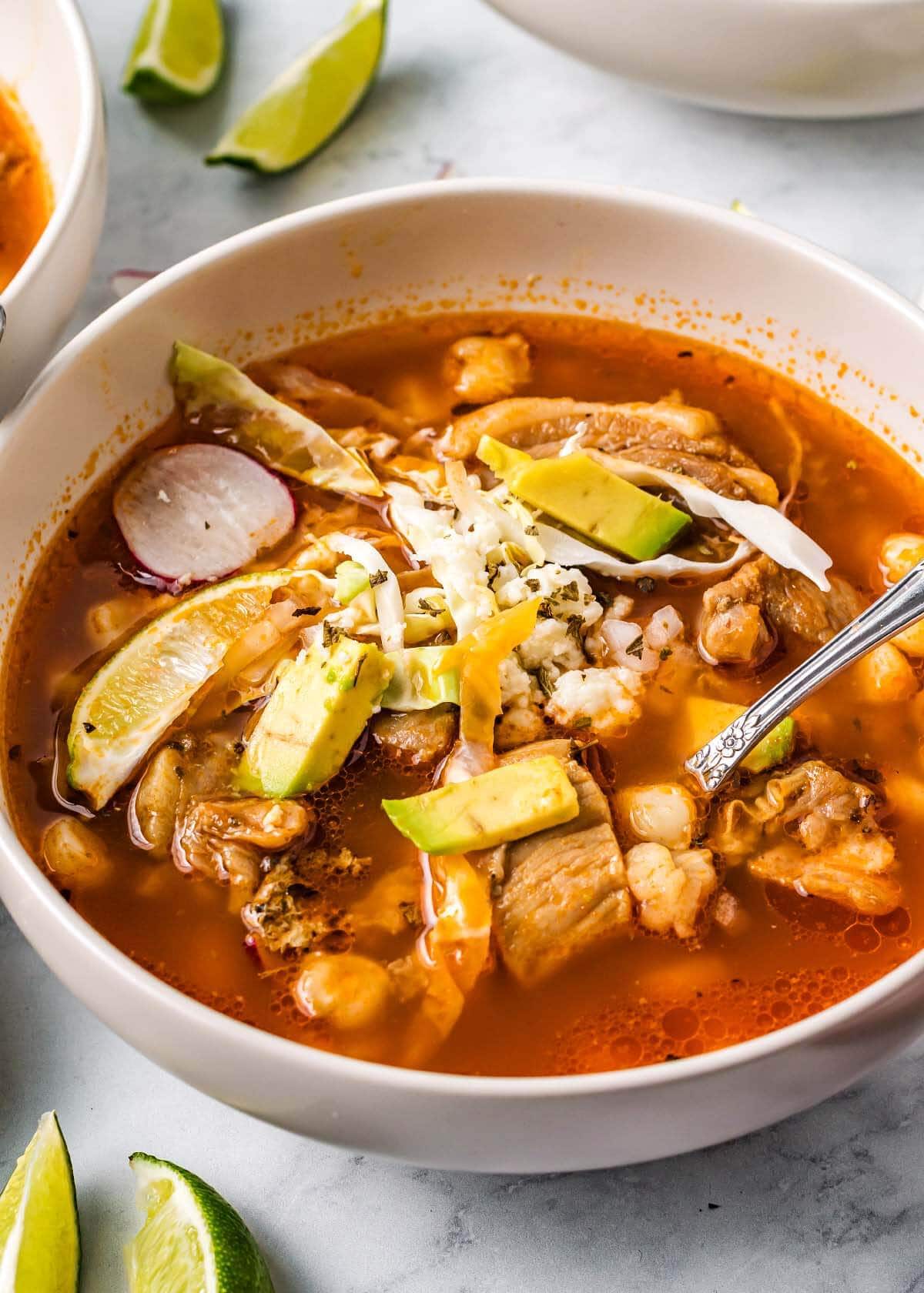 pozole in a bowl with spoon