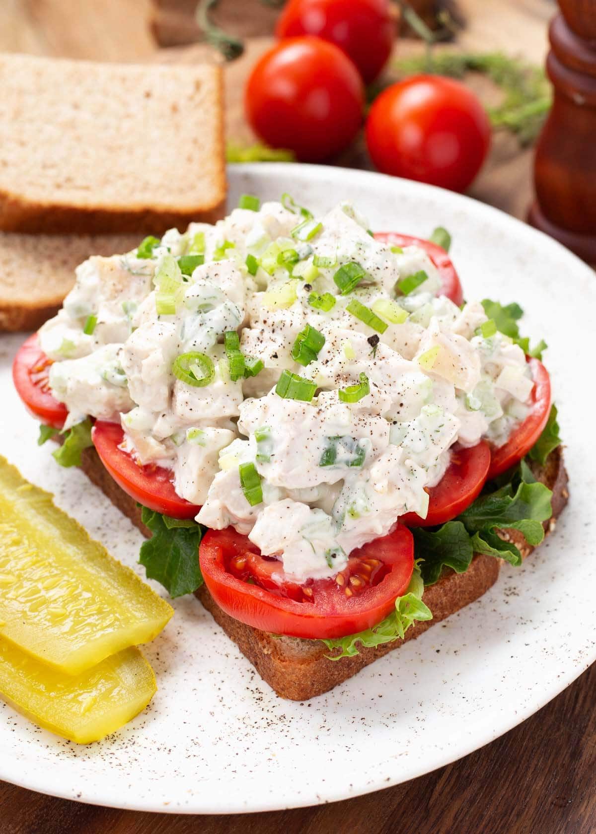 Easy Chicken Salad on bread with tomato slices.