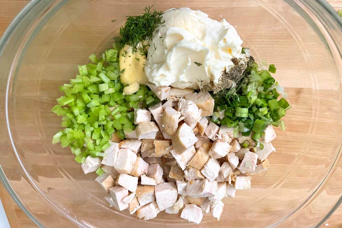 chicken salad ingredients in a bowl.