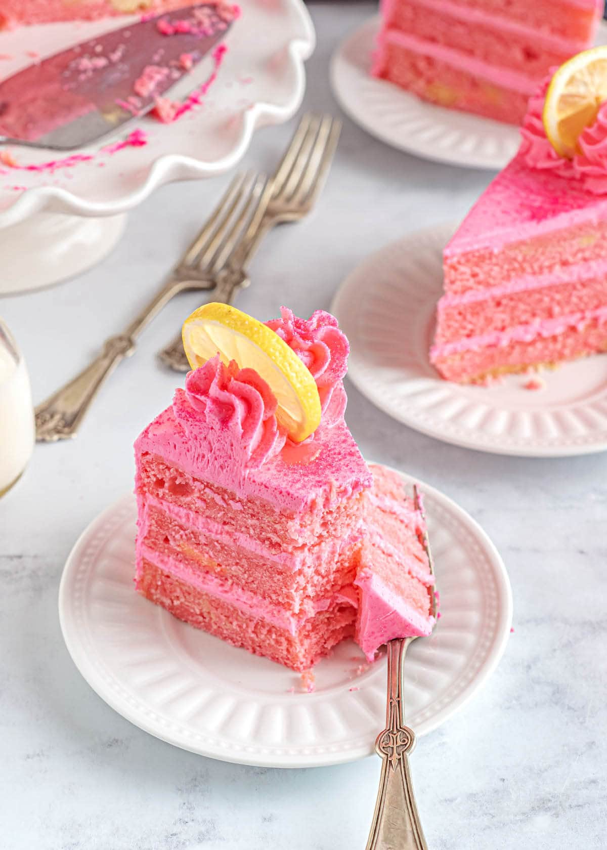 Pink Lemonade Cake slice on a plate