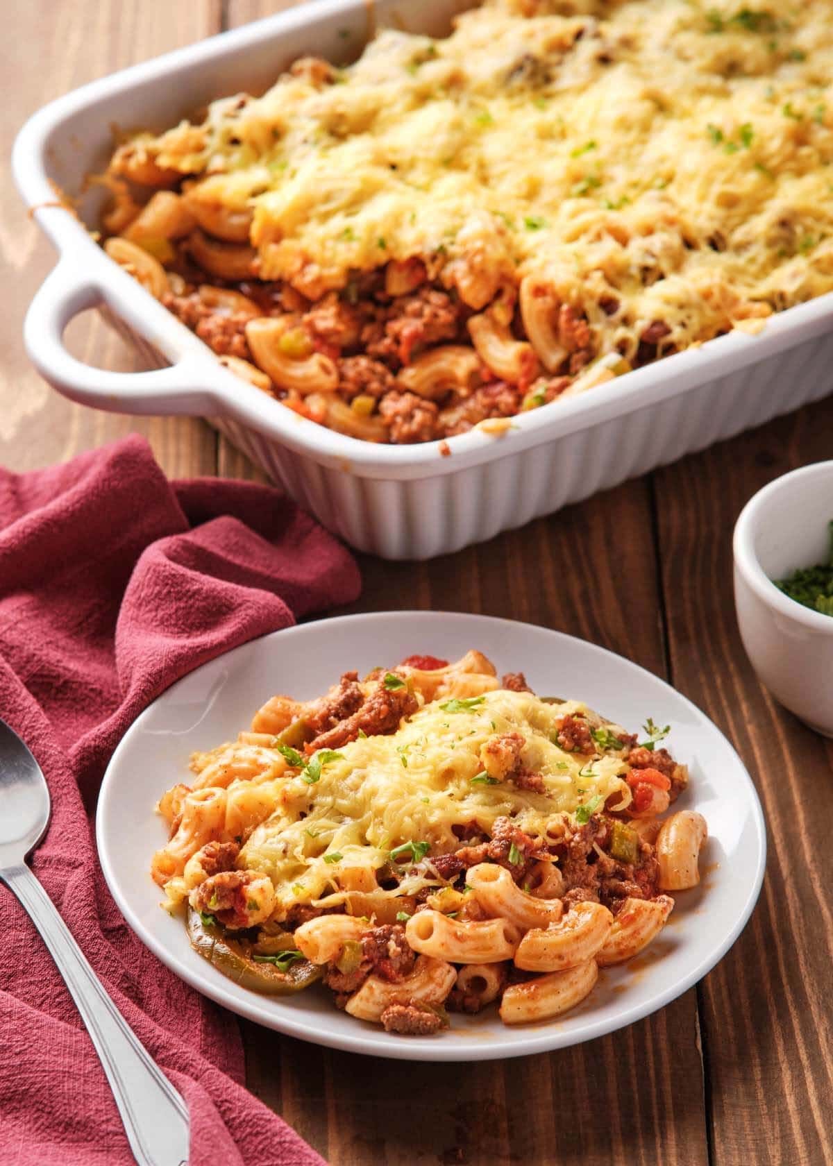 Sloppy Joe Casserole in white baking dish and on a plate.