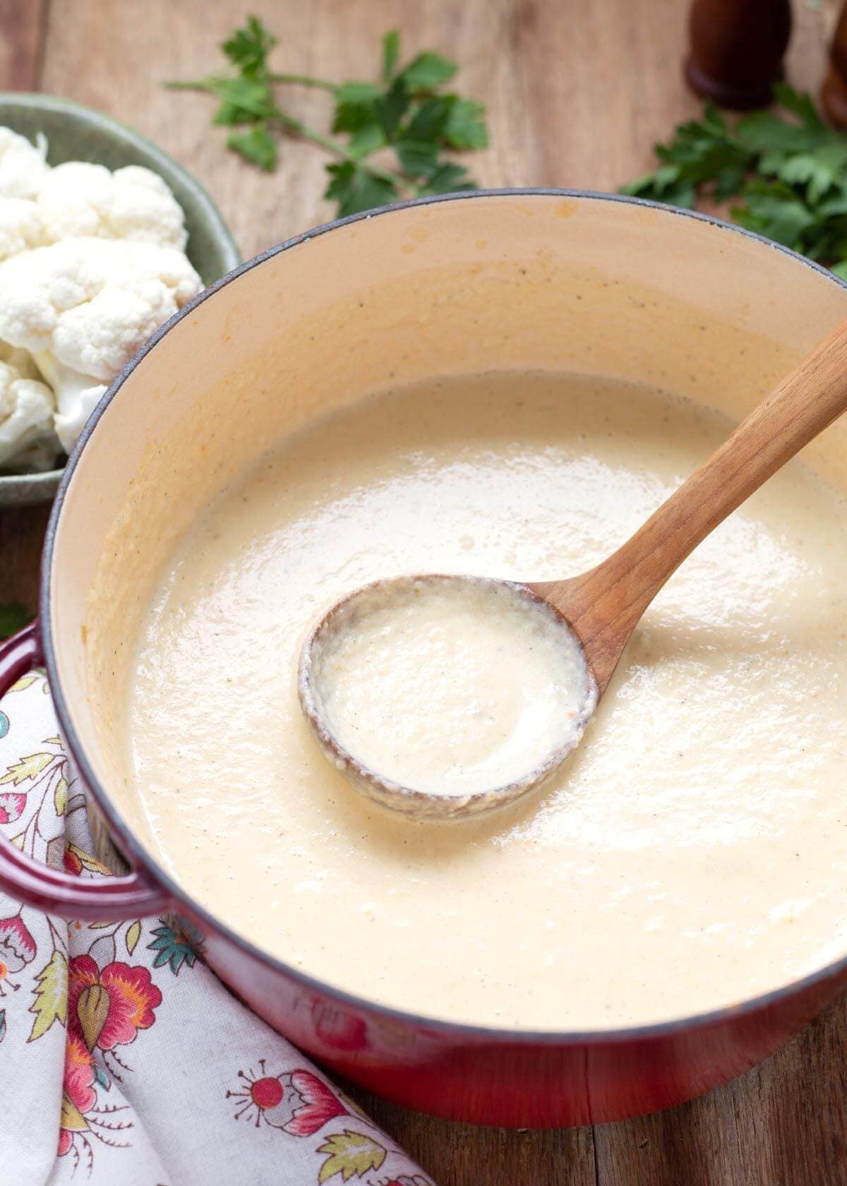 Creamy Cauliflower Soup in a pot with ladle.