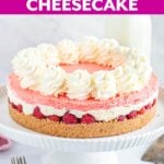 No-Bake Layered Raspberry Cheesecake on a white cake stand