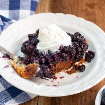 Slow Cooker Blueberry Cobbler portion on a white plate.