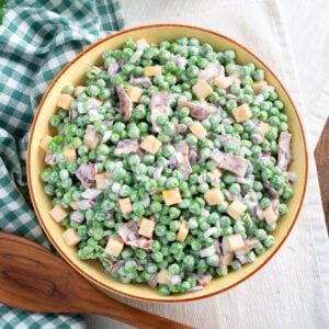 Creamy Pea Salad in a yellow bowl.