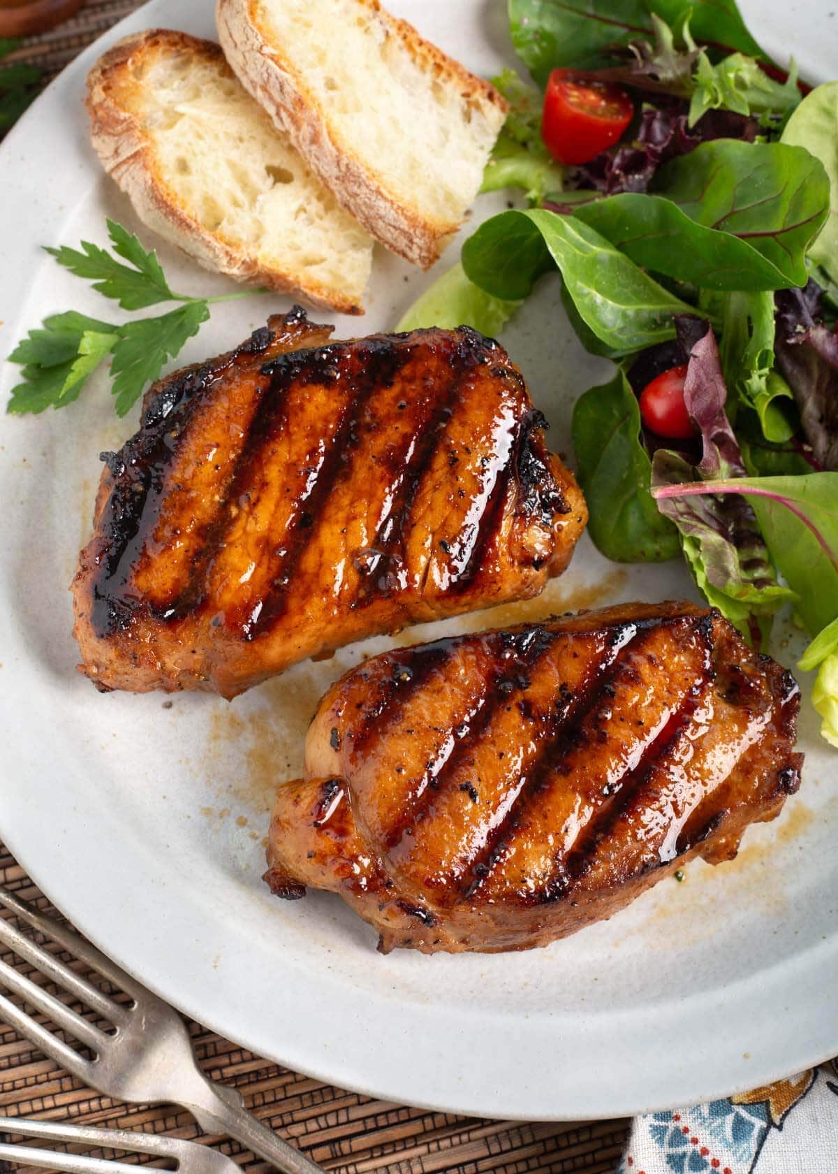Pork Chops on a plate with salad.