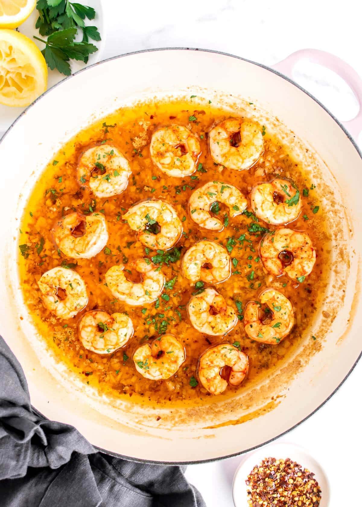 Shrimp Scampi in a white pan.
