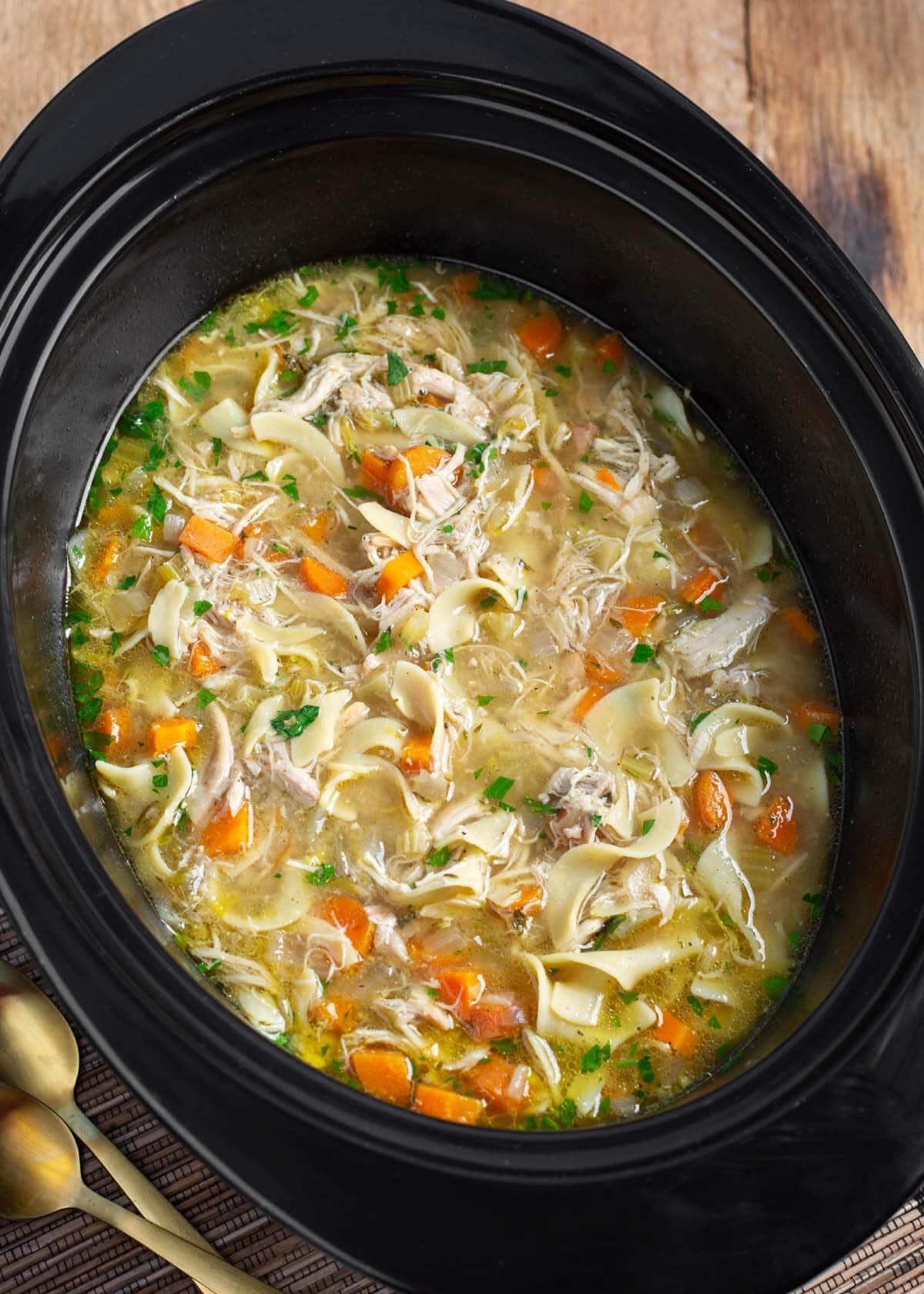 Slow Cooker Chicken Noodle Soup in a crock.