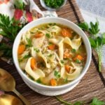 Slow Cooker Chicken Noodle Soup in white bowl.