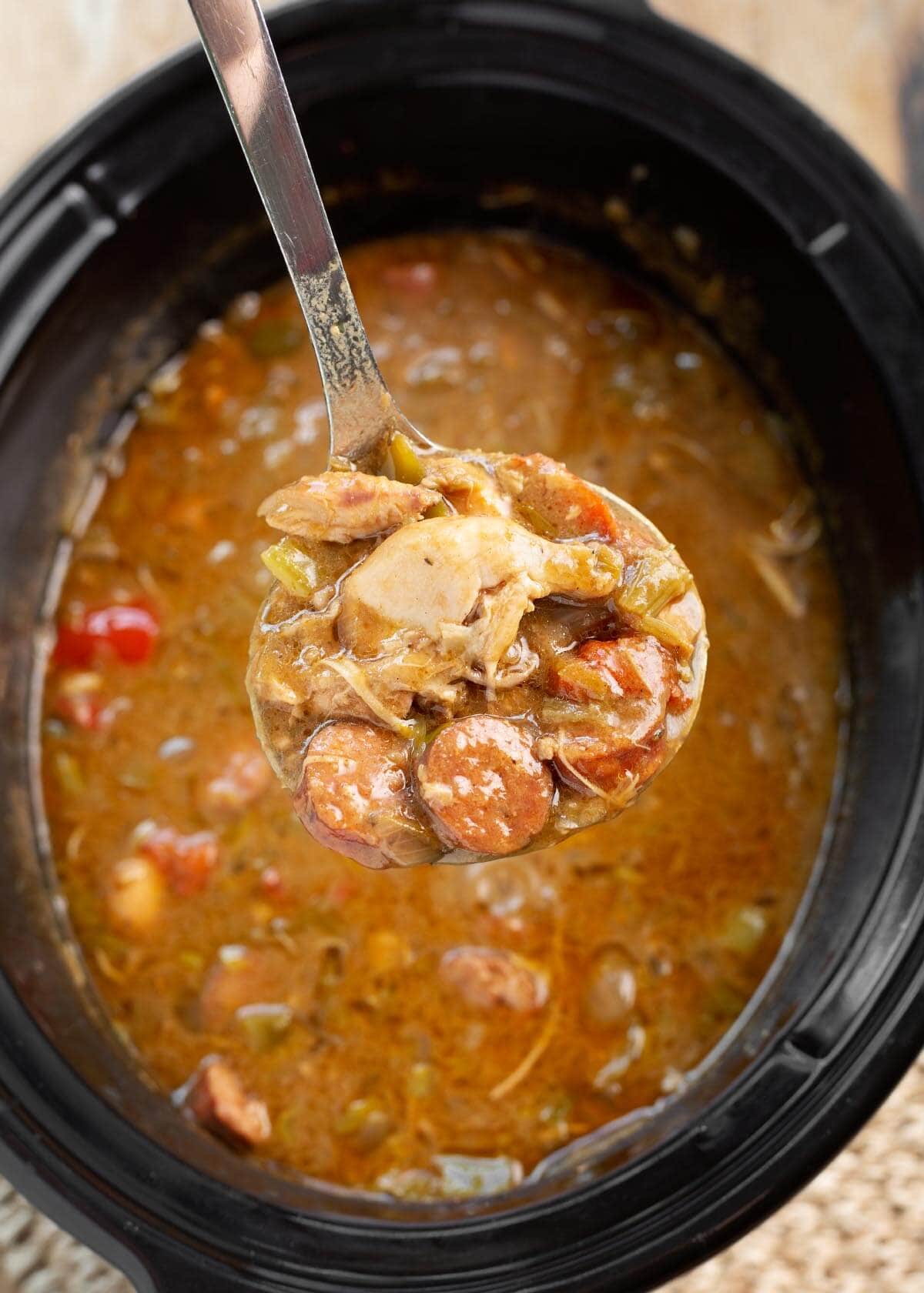 Slow Cooker Chicken Sausage Gumbo in a ladle.