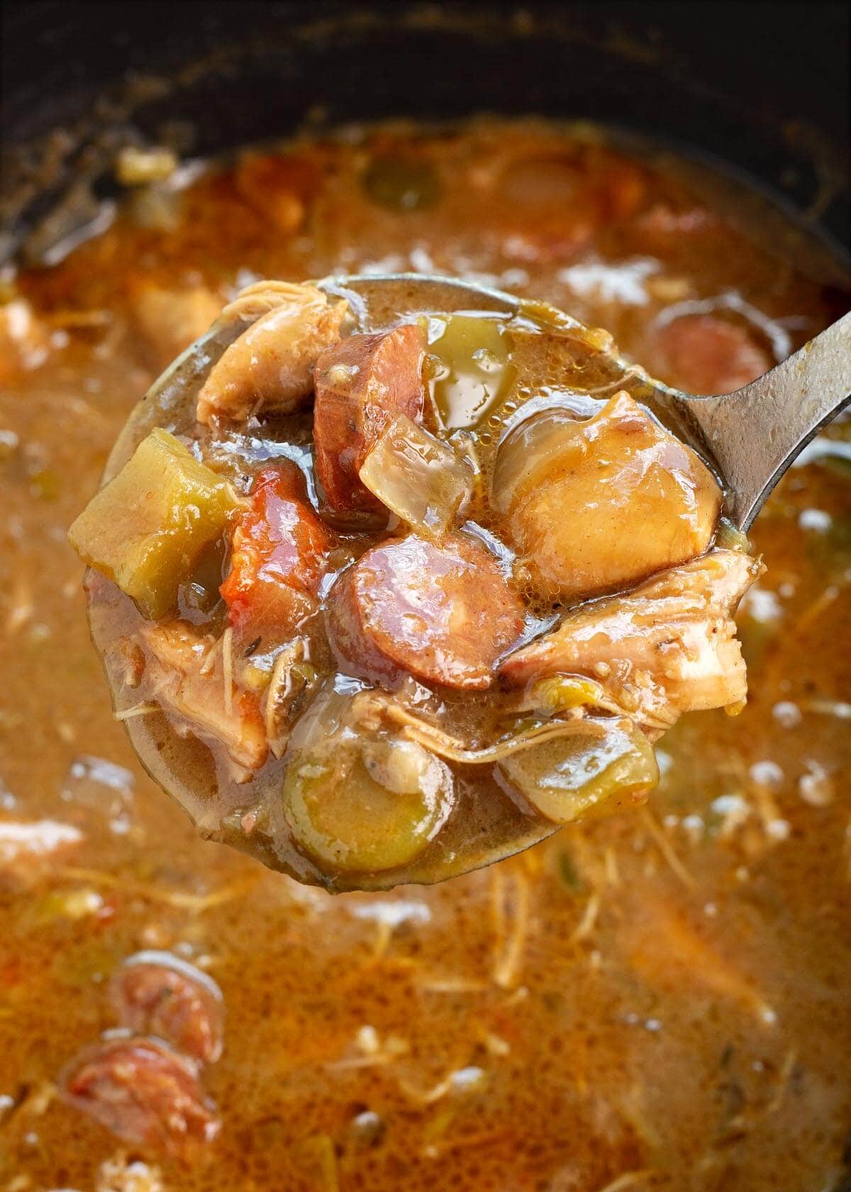 Slow Cooker Chicken Sausage Gumbo in a ladle.