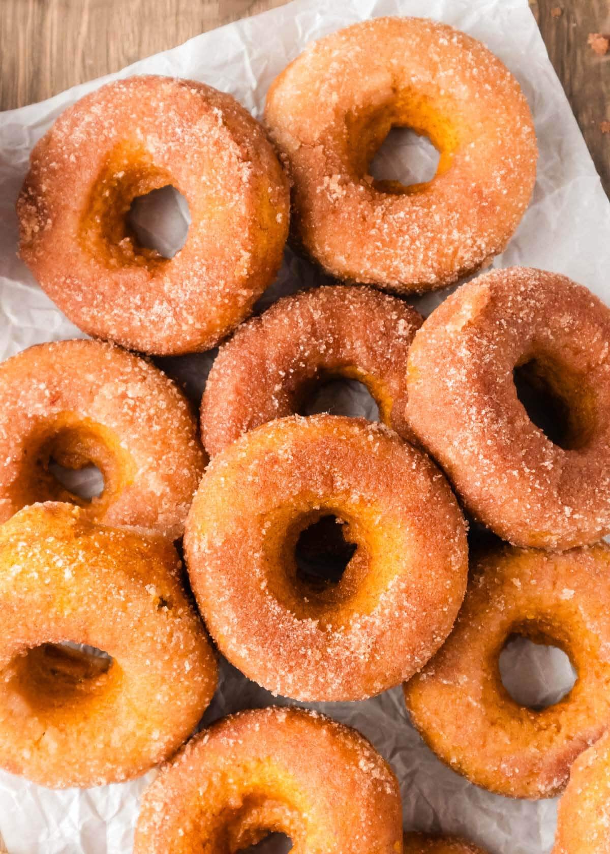 Baked Pumpkin Cake Mix Donuts in a pile.