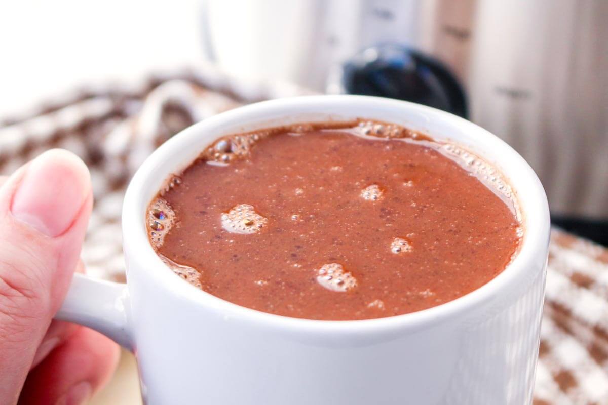 Slow Cooker Mexican Hot Chocolate in a white mug closeup.