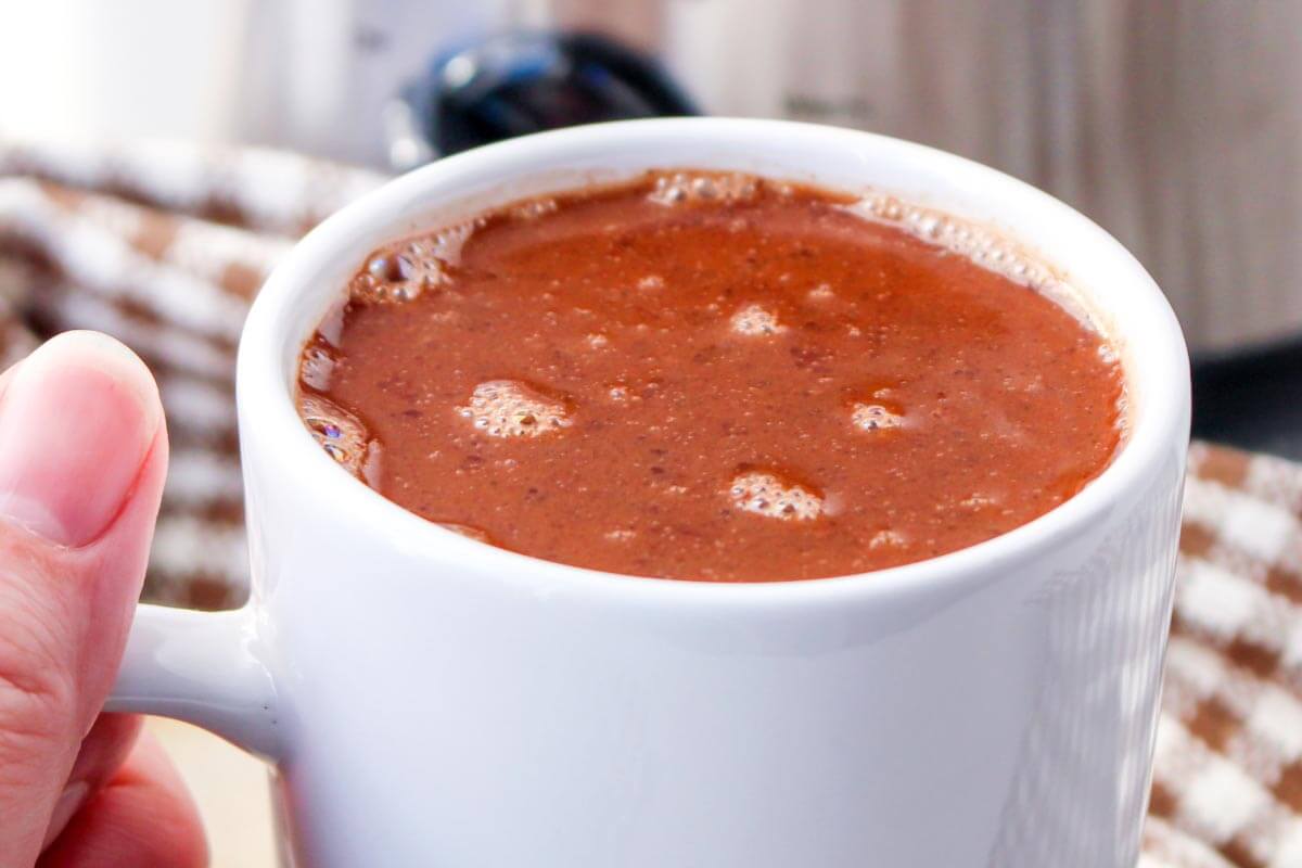 Slow Cooker Mexican Hot Chocolate in white mug closeup.