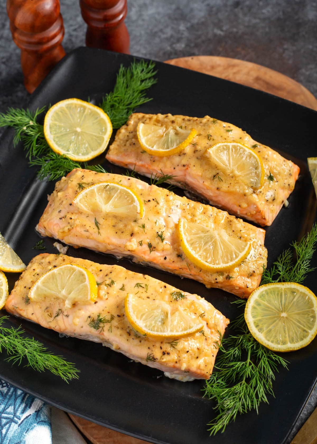 Baked Dijon Salmon Filets on a black plate