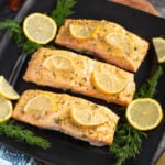 Baked Dijon Salmon Filets on a black plate