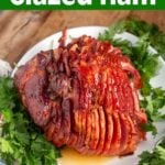 Brown Sugar Glazed Spiral Ham on a white plate