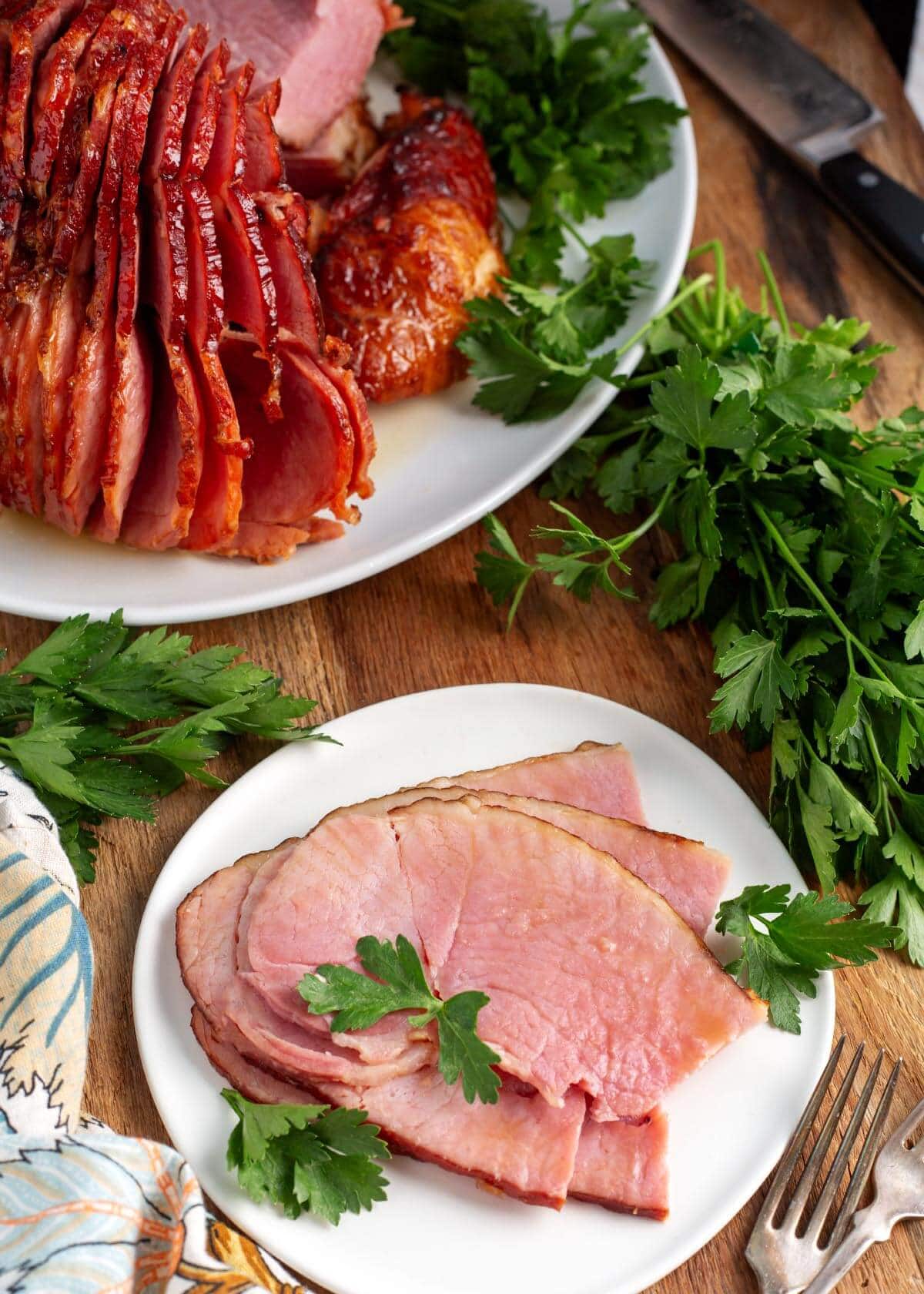 Brown Sugar Glazed Spiral Ham on a white plate