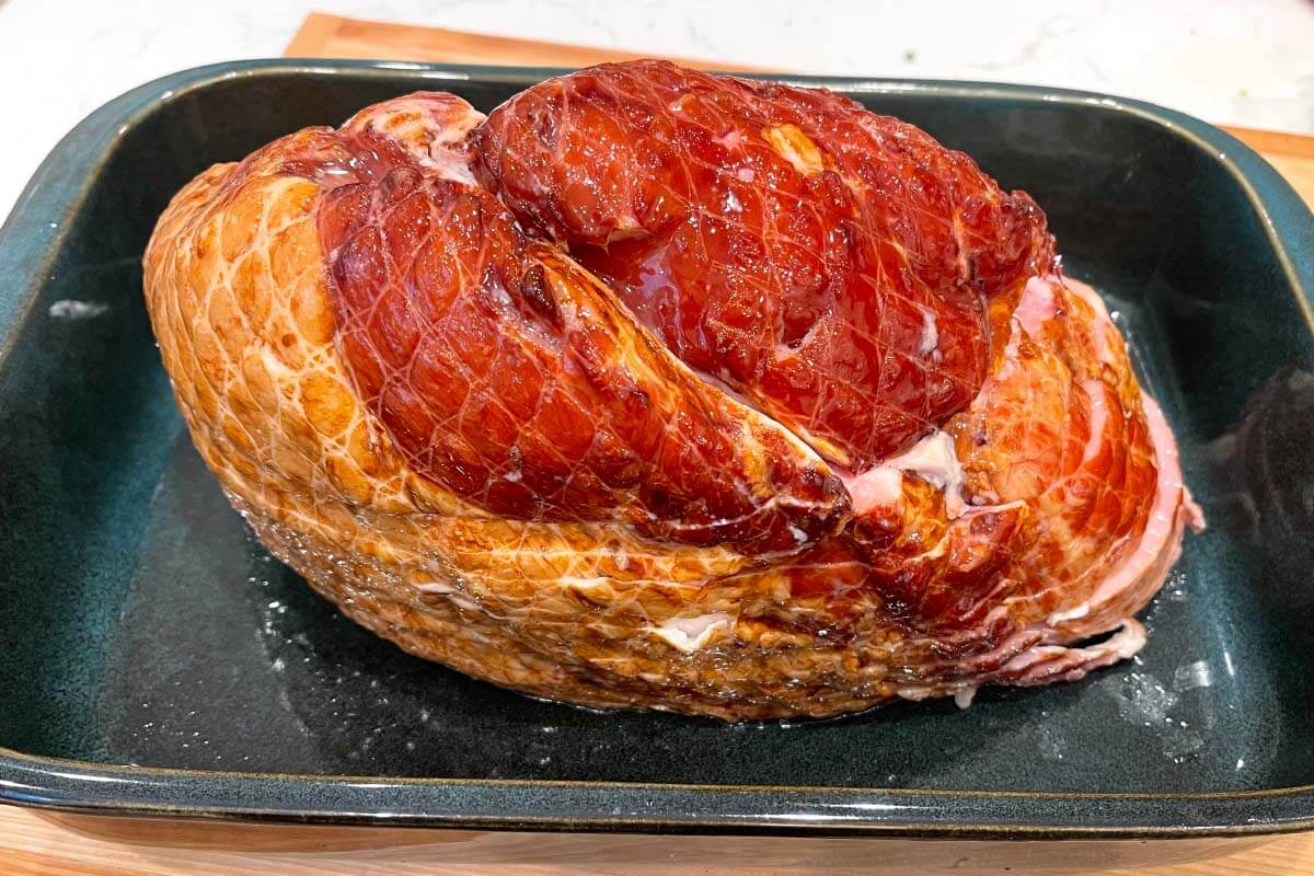 Brown Sugar Glazed Spiral Ham on a baking dish