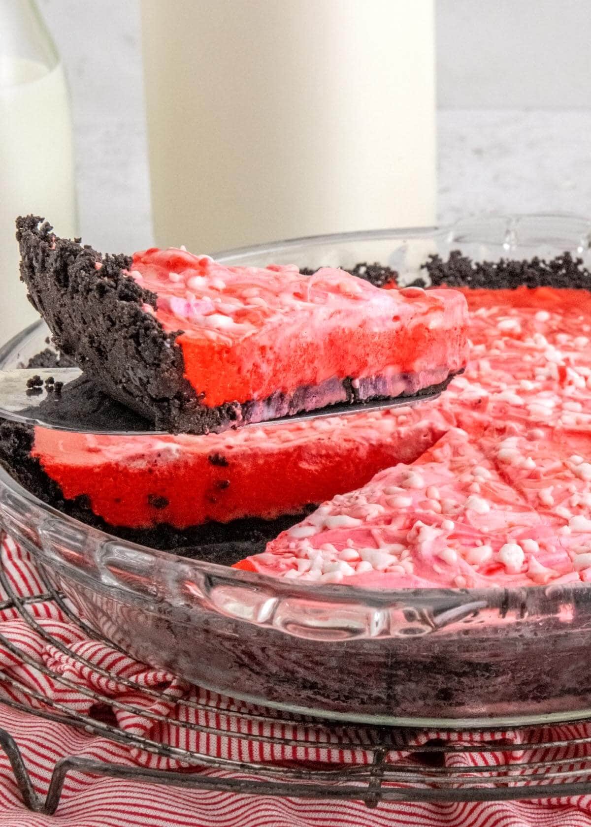 No-Bake Candy Cane Pie slice lifted from dish.