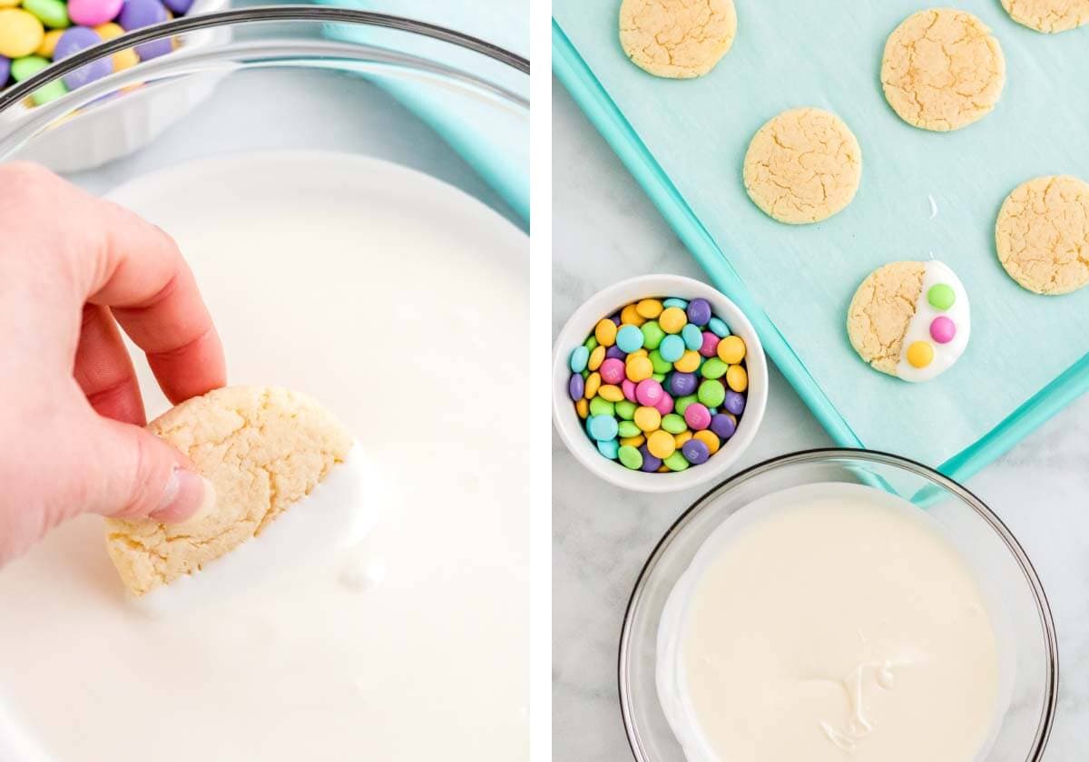 dipping cookie in white chocolate, candy on dipped cookie on a teal cookie sheet.