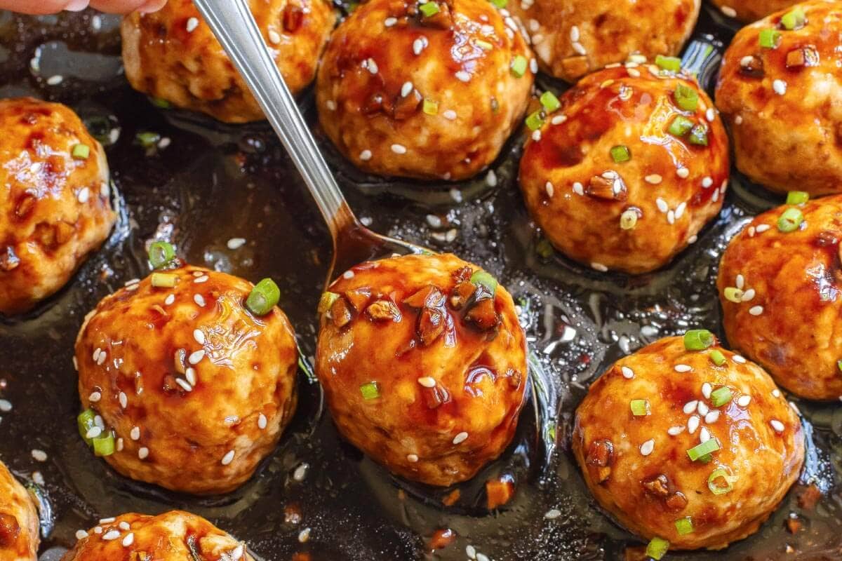 Teriyaki Chicken Meatballs closeup with spoon.
