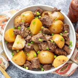 Slow Cooker Garlic Butter Steak Bites in a white bowl