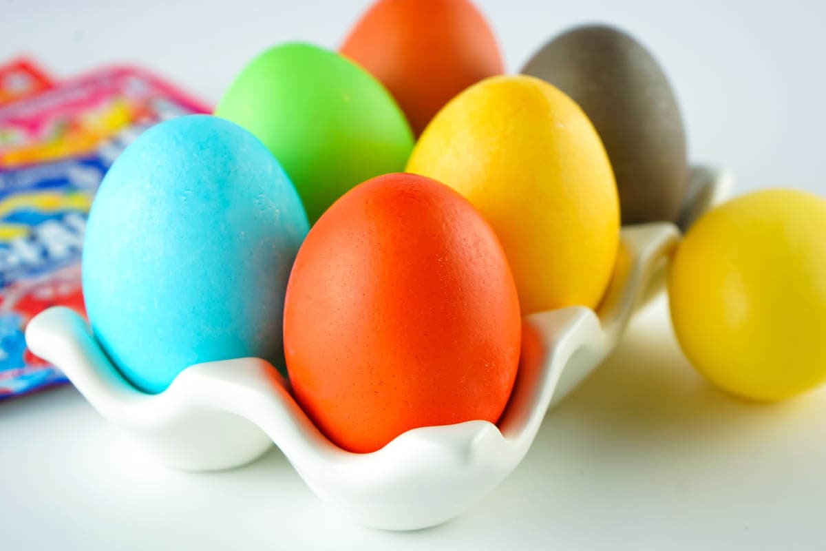 6-egg egg carton with dyed Easter eggs.