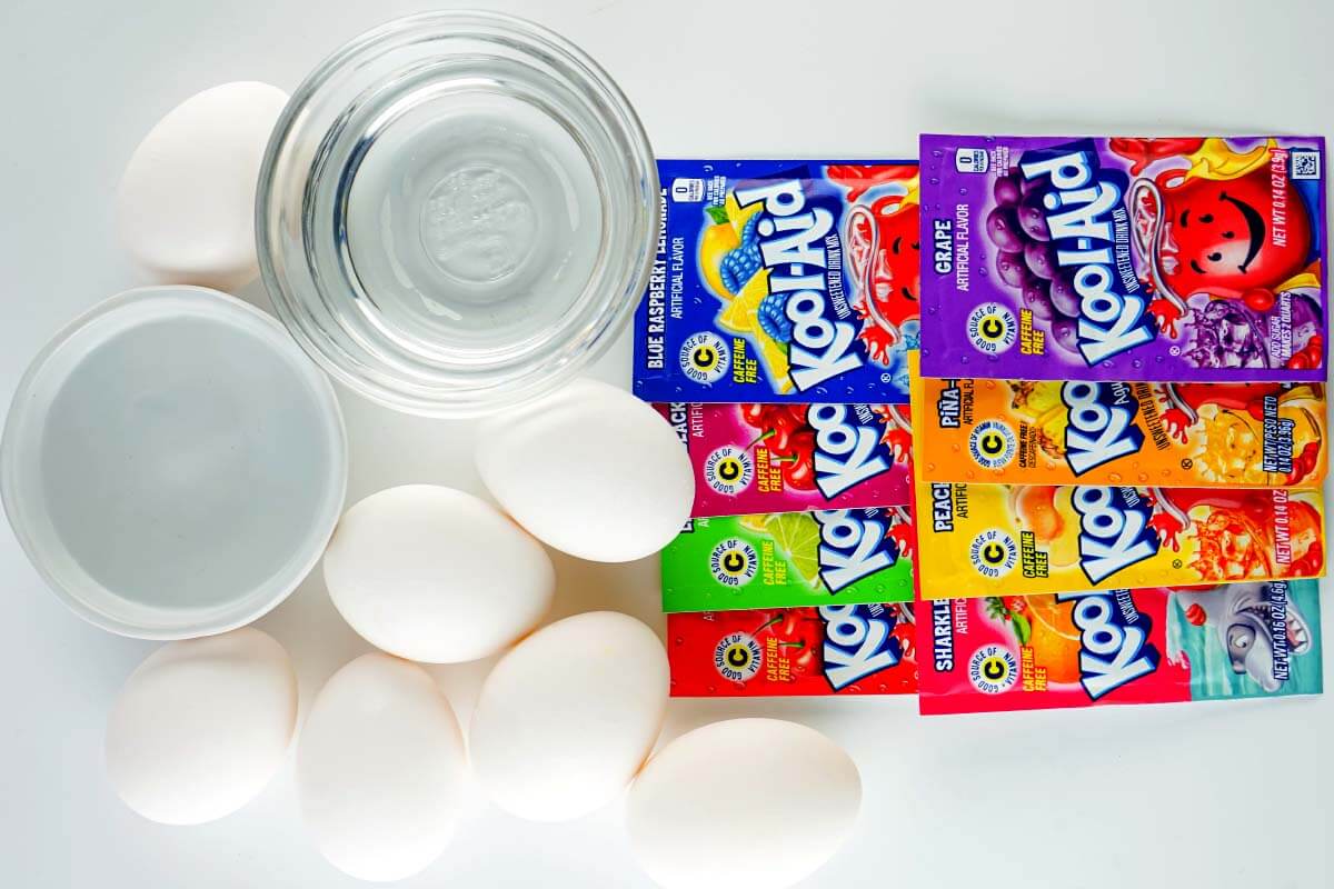8 packets of koolaid, 7 eggs, glass of water, container of vinegar.