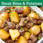 Slow Cooker Garlic Butter Steak Bites and Potatoes in a white bowl.
